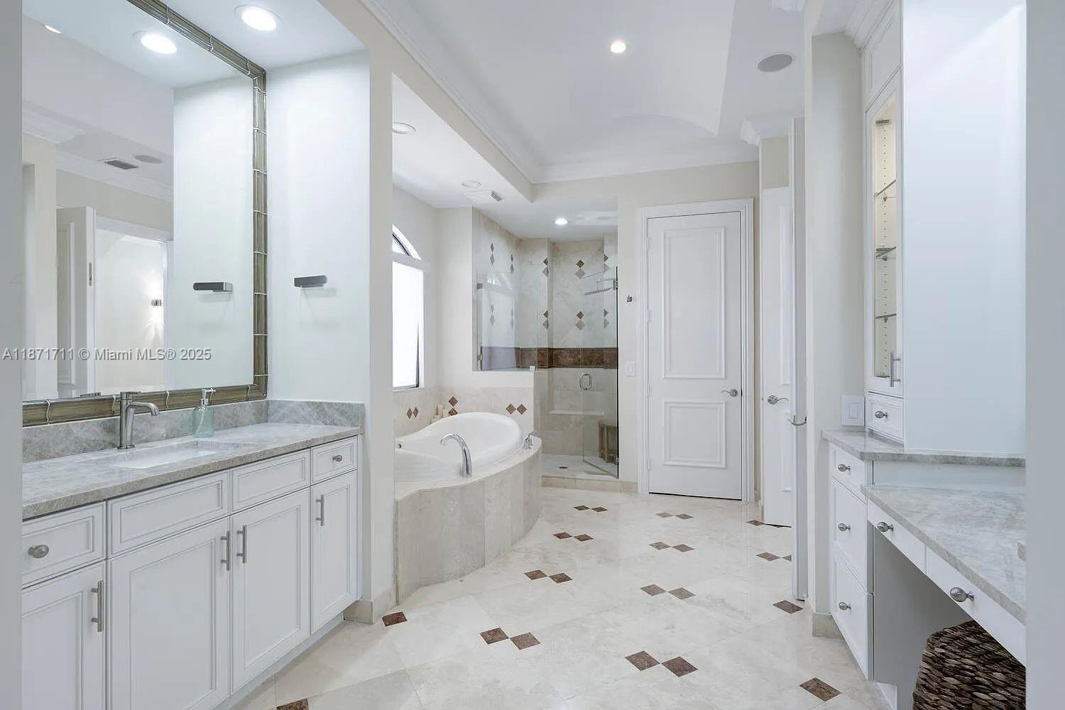 17838 Monte Vista Drive Boca Raton, FL 33496 - Photo 37 of 66 a spacious bathroom with a shower sink double and mirror