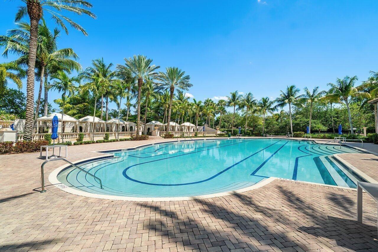 17838 Monte Vista Drive Boca Raton, FL 33496 - Photo 52 of 66 a view of swimming pool with outdoor seating and plants