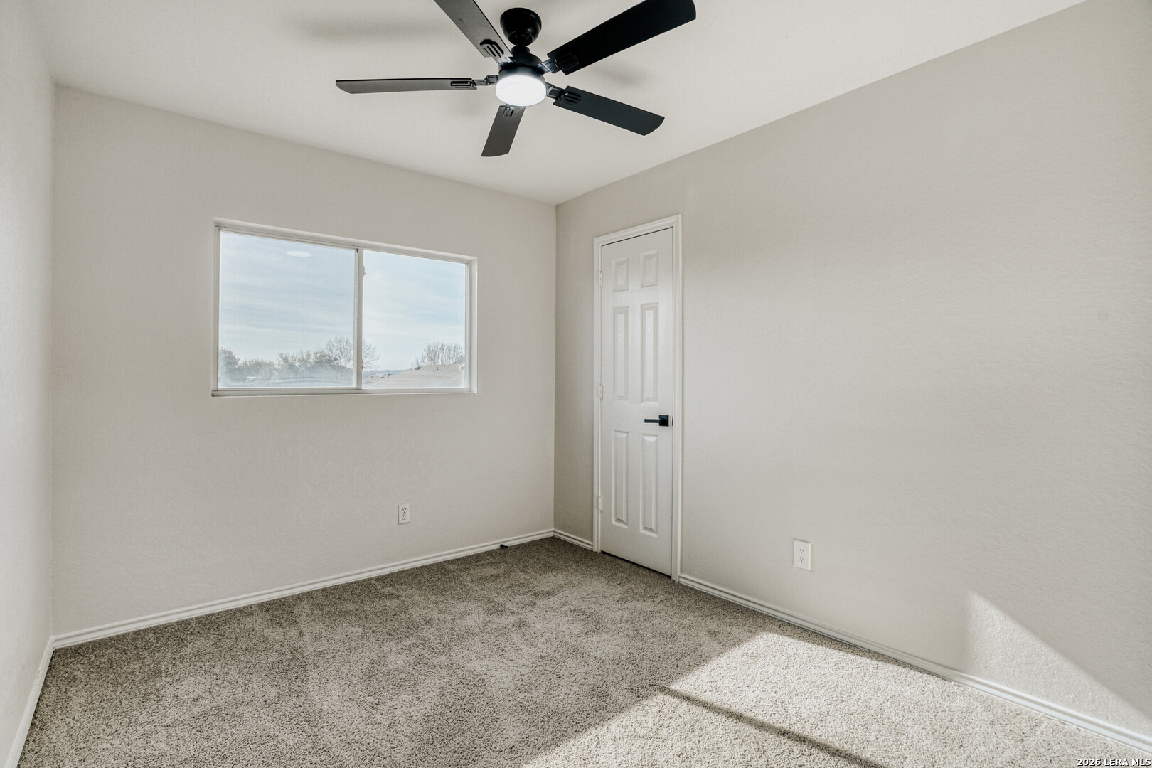 312 Passerina Spur Schertz, TX 78154 - Photo 20 of 26 a view of an empty room with a window