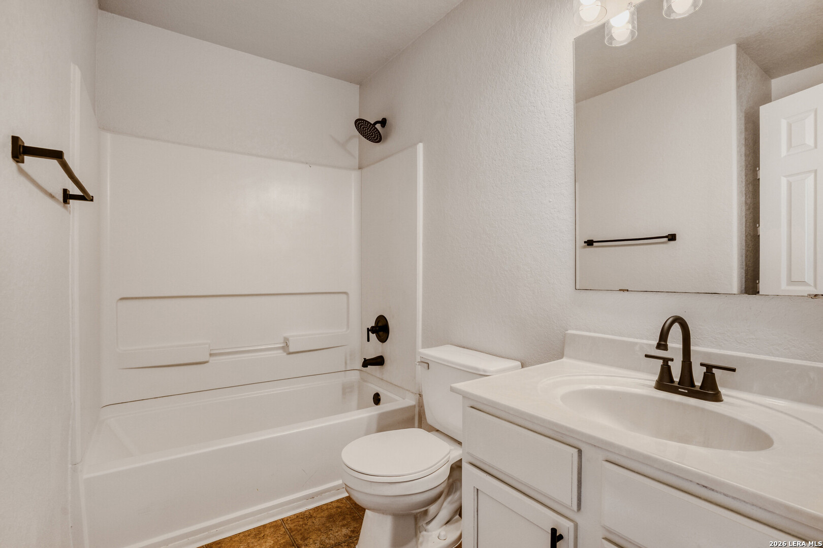 312 Passerina Spur Schertz, TX 78154 - Photo 24 of 26 a bathroom with a sink a toilet and shower