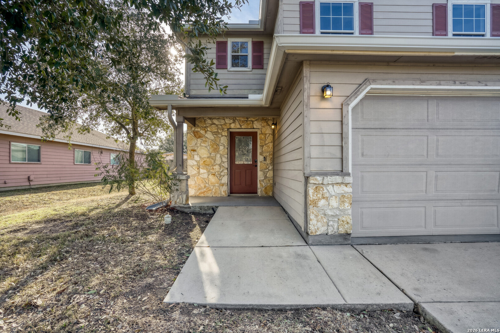 312 Passerina Spur Schertz, TX 78154 - Photo 3 of 26 a front view of a house with a yard