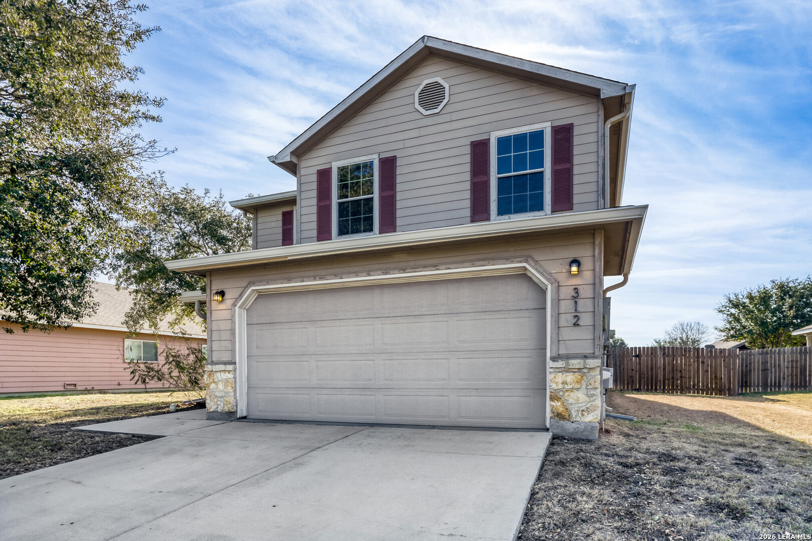 312 Passerina Spur Schertz, TX 78154 - Photo 4 of 26 a front view of a house with a garage