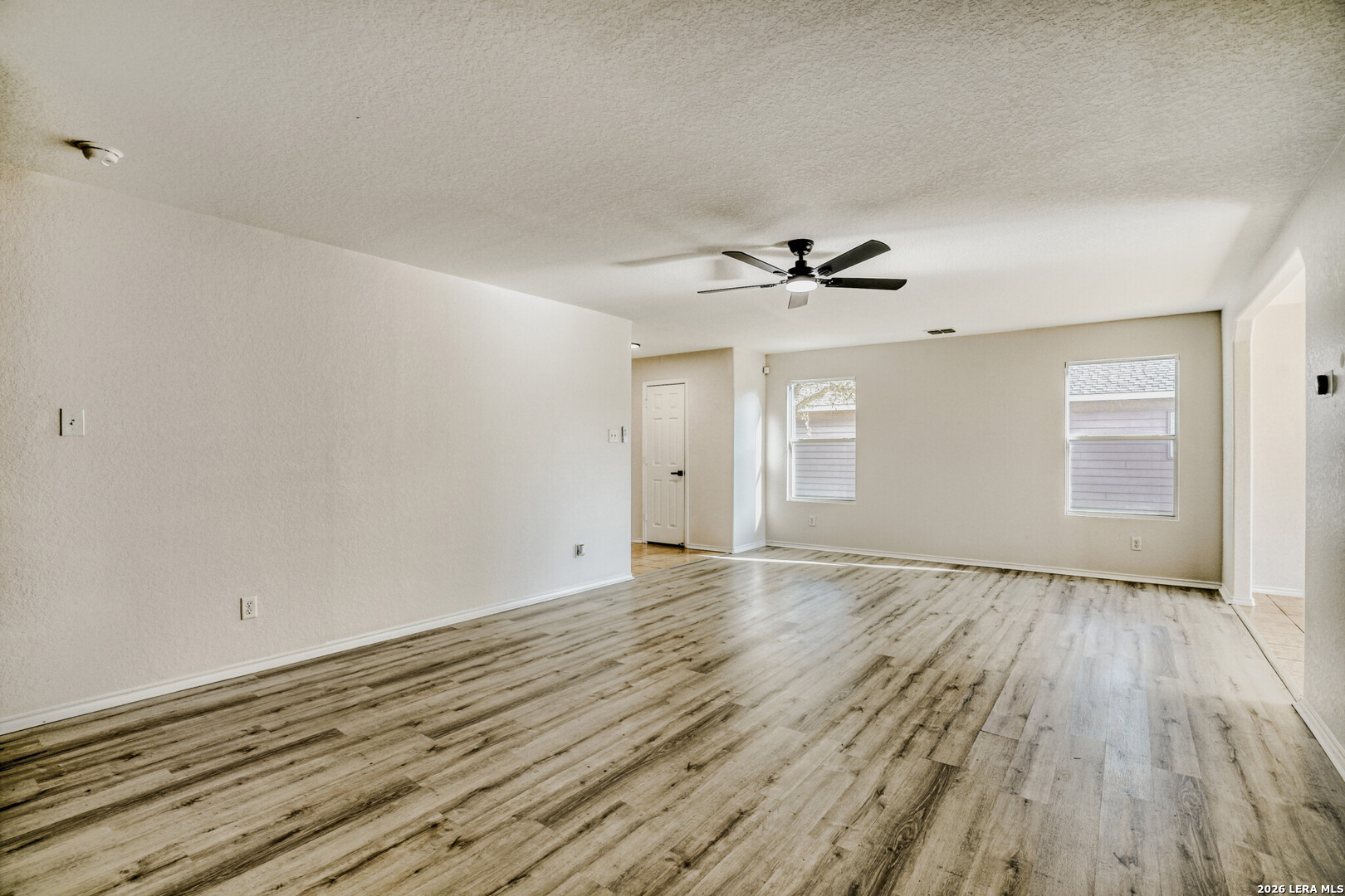 312 Passerina Spur Schertz, TX 78154 - Photo 7 of 26 wooden floor in an empty room