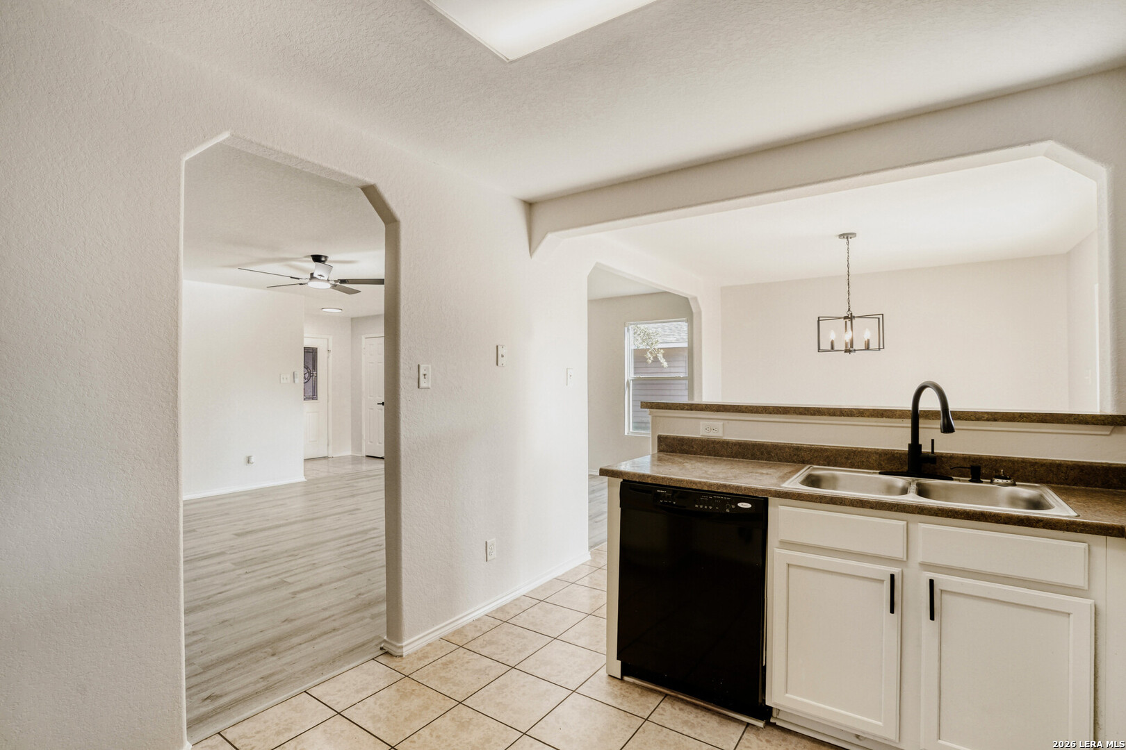 312 Passerina Spur Schertz, TX 78154 - Photo 10 of 26 a kitchen with a sink and cabinets