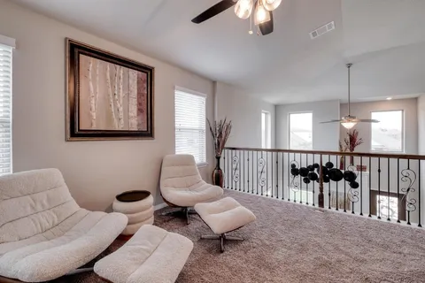 a bathroom with a sink mirror and toilet