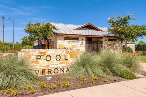 a front view of a house with yard and porch