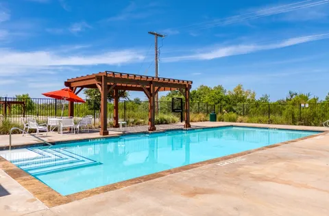 swimming pool with outdoor seating