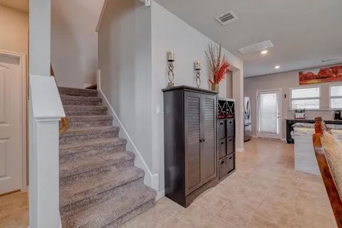 a view of a hallway view with staircase