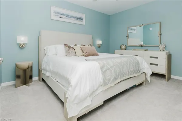 a bedroom with a bed and a view of bathroom