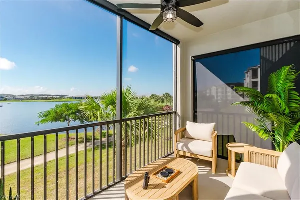 a view of a balcony with furniture