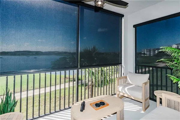 a view of a balcony with furniture