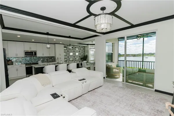 a large bedroom with a bed and a large window
