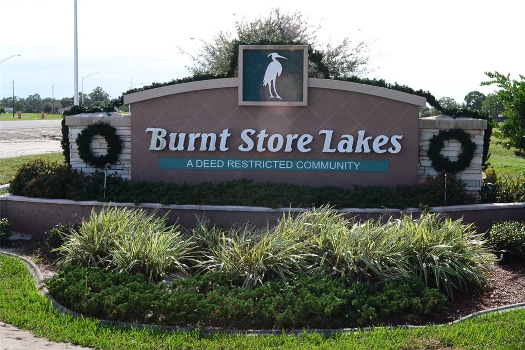 23999 Cedar Rapids Road Punta Gorda, FL 33955 - Photo 12 of 12 a view of front of house with a garden