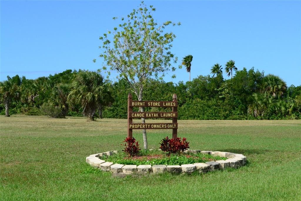 23999 Cedar Rapids Road Punta Gorda, FL 33955 - Photo 10 of 12 a front view of a house with a yard