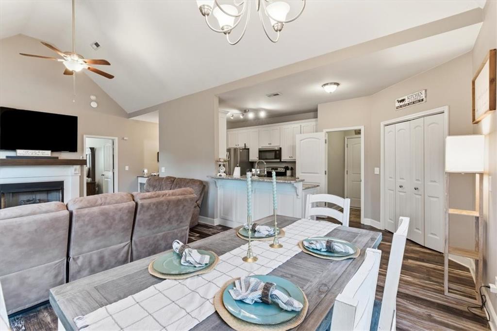 59 Round Rock Circle Northeast Rome, GA 30161 - Photo 14 of 46 a living room with fireplace furniture and a flat screen tv