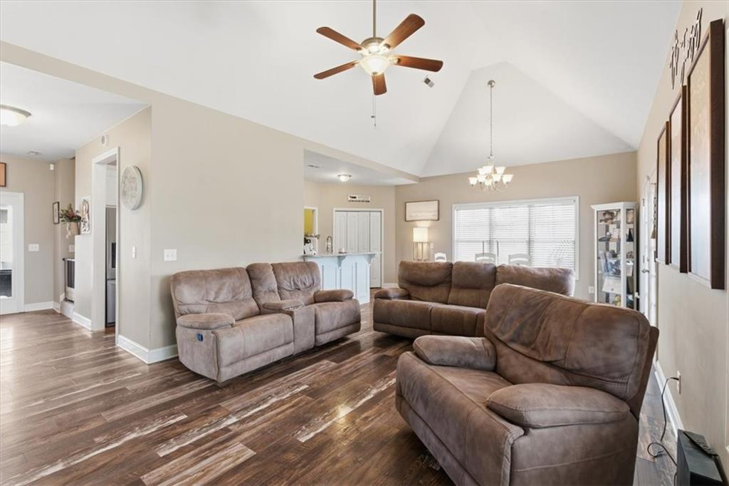 59 Round Rock Circle Northeast Rome, GA 30161 - Photo 16 of 46 a living room with furniture a ceiling fan and a rug