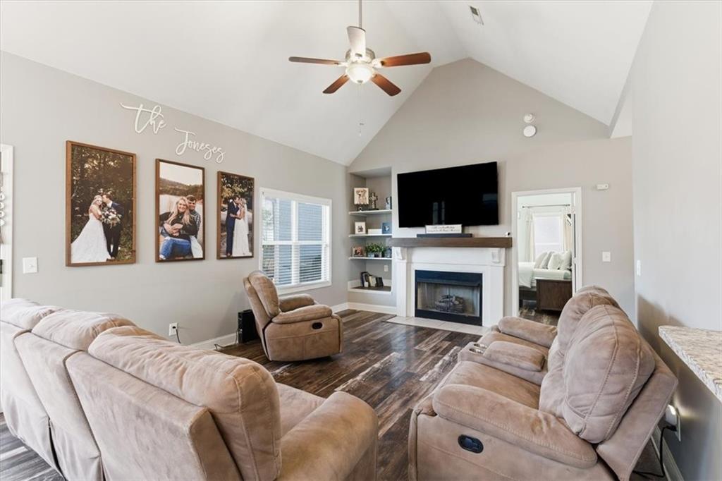 59 Round Rock Circle Northeast Rome, GA 30161 - Photo 17 of 46 a living room with furniture a fireplace and a flat screen tv