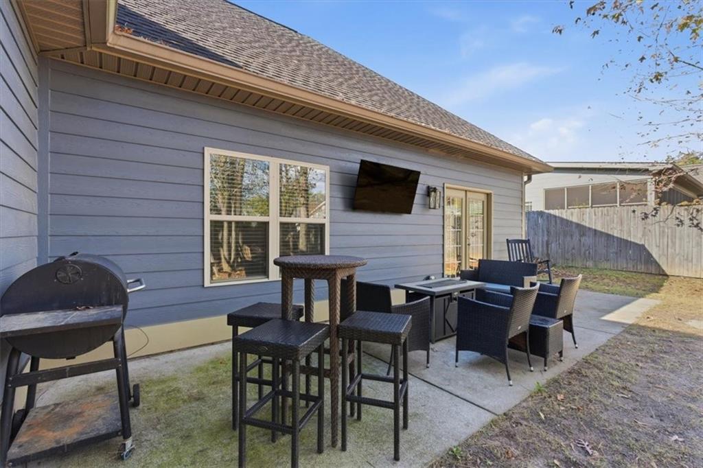 59 Round Rock Circle Northeast Rome, GA 30161 - Photo 31 of 46 a patio with table and chairs