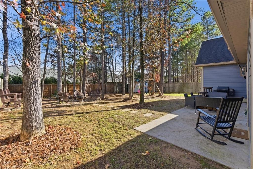 59 Round Rock Circle Northeast Rome, GA 30161 - Photo 32 of 46 a view of a house with backyard and sitting area