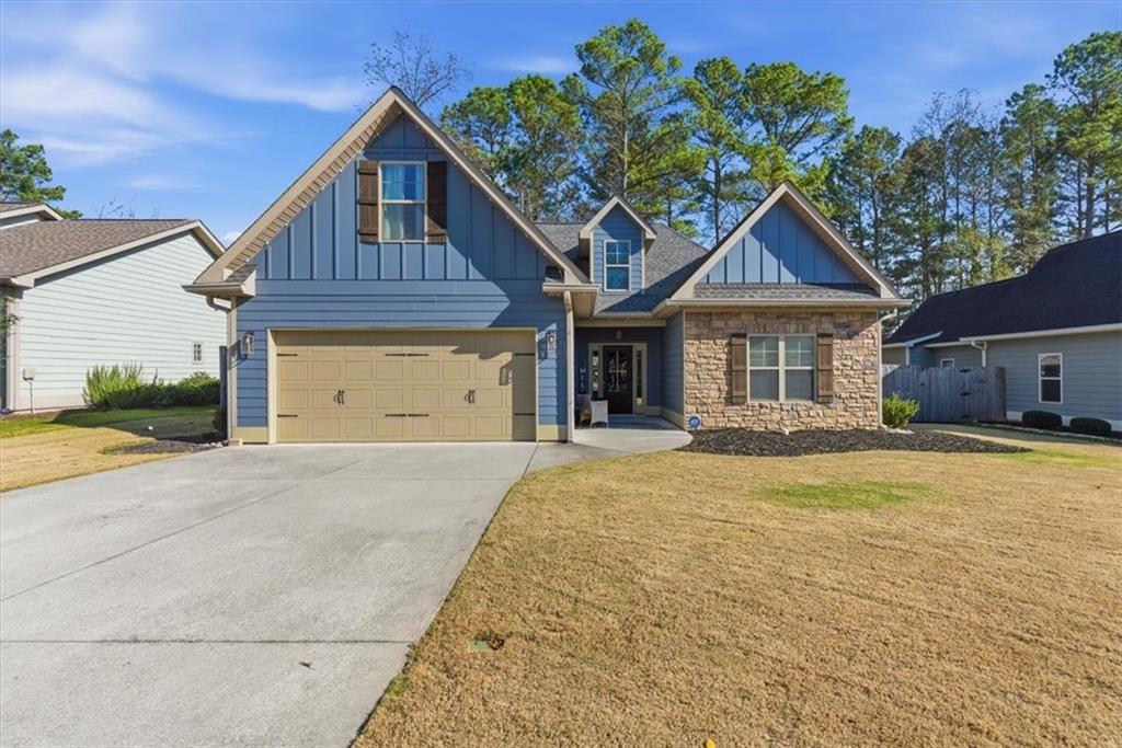 59 Round Rock Circle Northeast Rome, GA 30161 - Photo 43 of 46 a front view of a house with a yard and garage