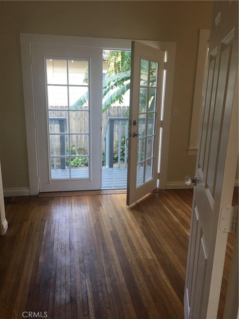 4193 5th Street Riverside, CA 92501 - Photo 21 of 33 wooden floor in an empty room with a window