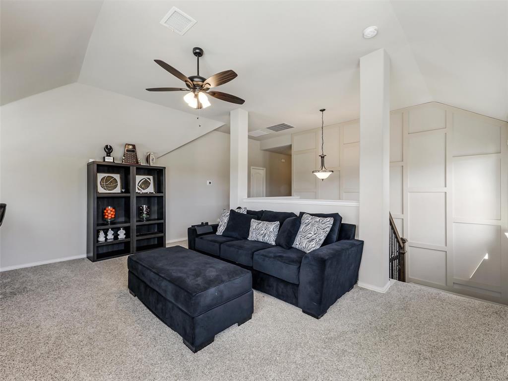 1216 Tree Shadow Lane Anna, TX 75409 - Photo 26 of 37 a living room with furniture a ceiling fan and a rug