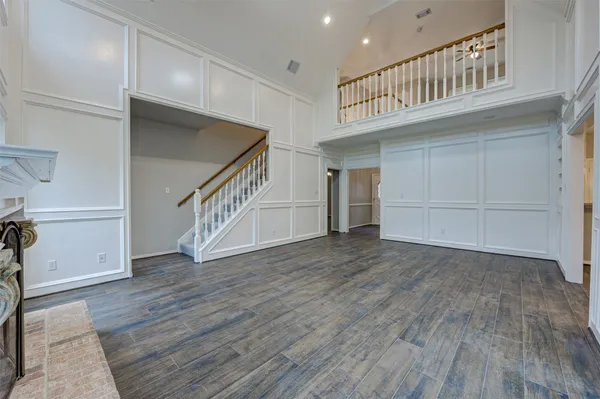 a view of an entryway with wooden floor