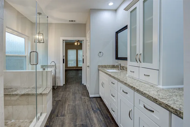 a view of a big house with a big yard and potted plants