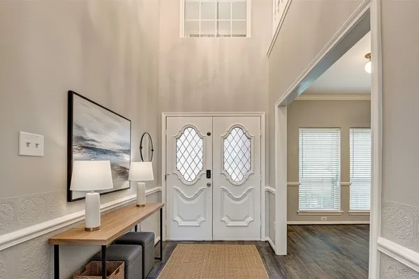 a view of room with window and wooden floor
