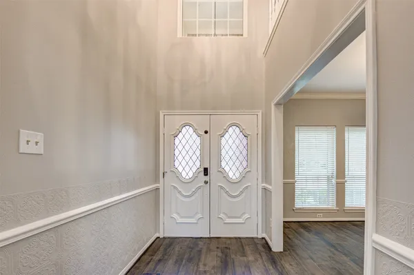 a view of entryway with wooden floor