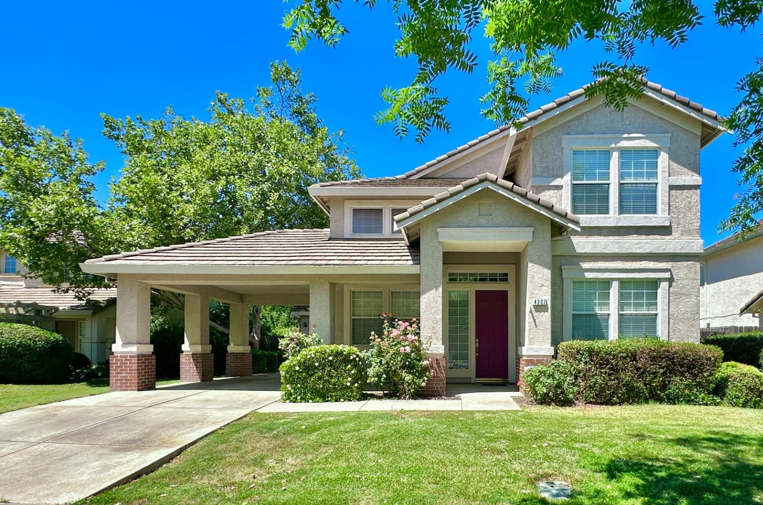 front view of a house with a yard
