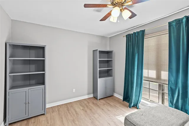 a view of room with window and cabinet