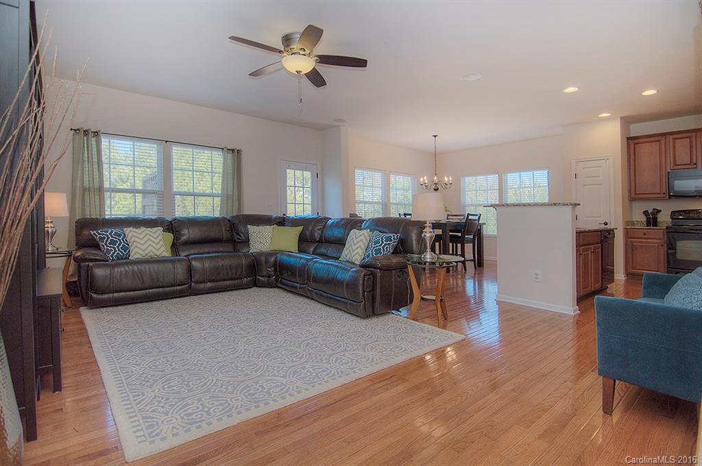 129 Inlet Point Drive, Unit 72 Tega Cay, SC 29708 - Photo 3 of 20 a living room with furniture and a large window