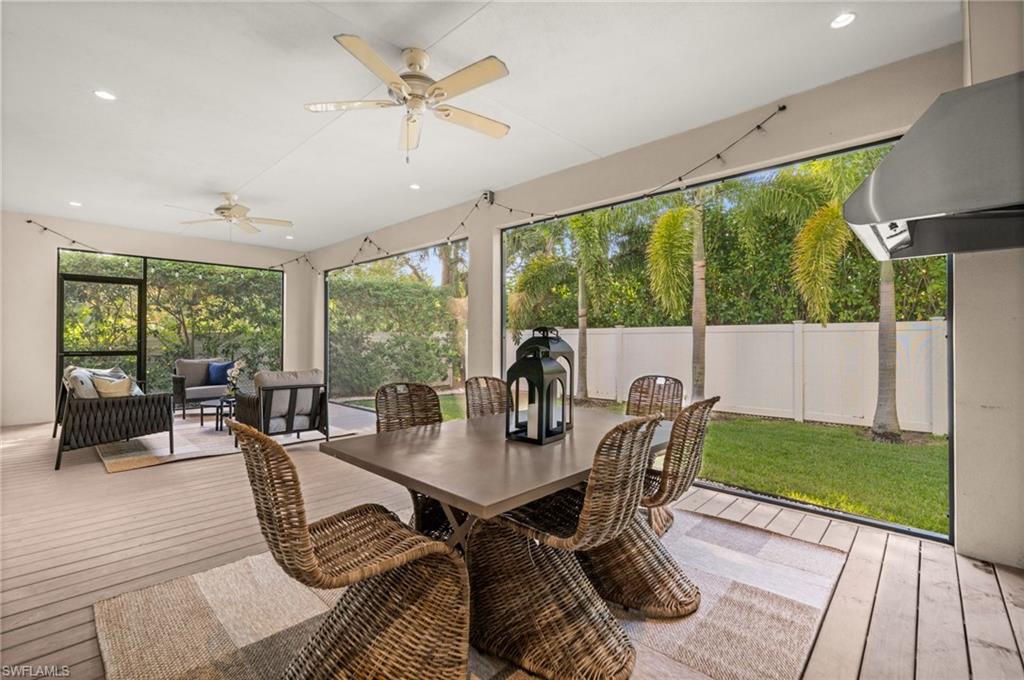 2499 10th Street North Naples, FL 34103 - Photo 14 of 33 a view of a dining room with furniture window and wooden floor