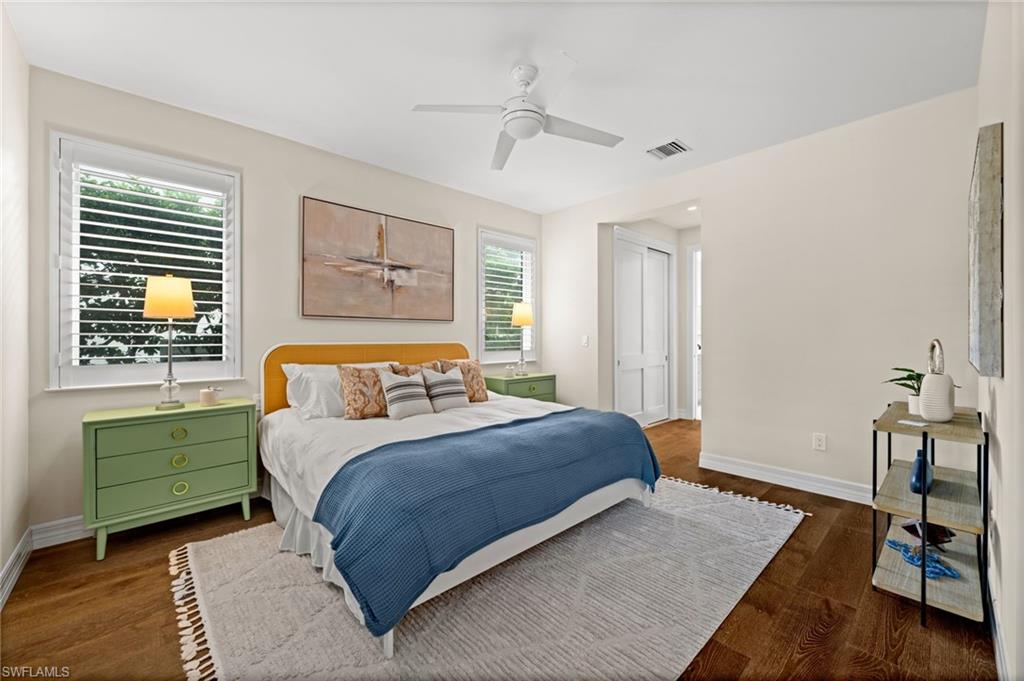 2499 10th Street North Naples, FL 34103 - Photo 20 of 33 a bedroom with a bed and a table