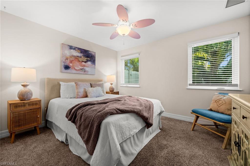 2499 10th Street North Naples, FL 34103 - Photo 23 of 33 a bedroom with bed and a window