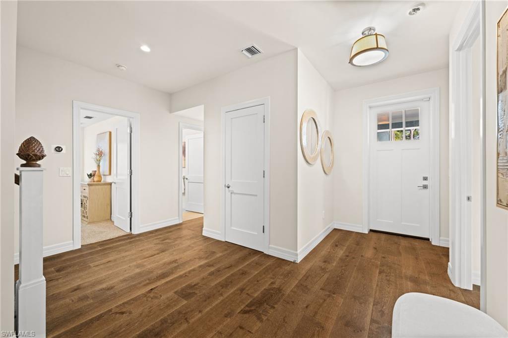 2499 10th Street North Naples, FL 34103 - Photo 3 of 33 a view of livingroom with hardwood floor and a ceiling fan