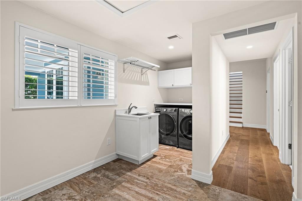 2499 10th Street North Naples, FL 34103 - Photo 31 of 33 a view of a storage & utility room with a window