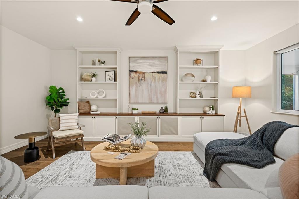 2499 10th Street North Naples, FL 34103 - Photo 4 of 33 a living room with furniture and a couch