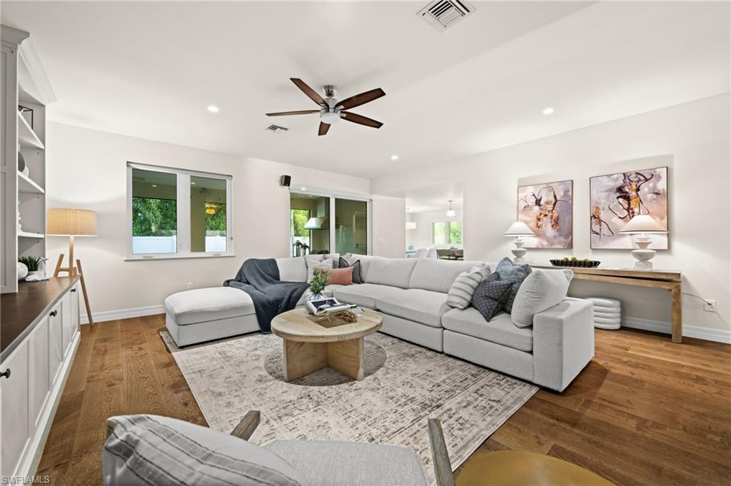 2499 10th Street North Naples, FL 34103 - Photo 8 of 33 a living room with furniture and a large window