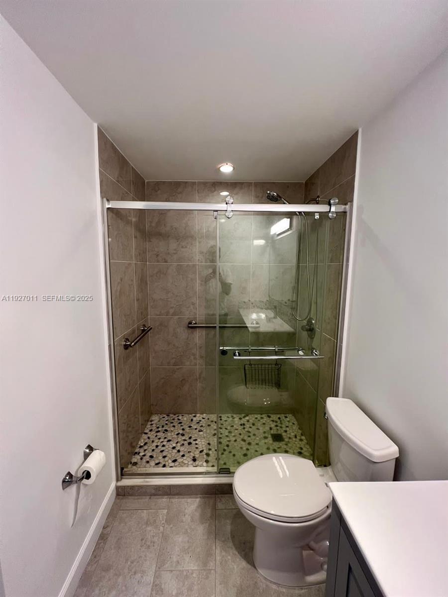 2201 Brickell Avenue, Unit 83 Miami, FL 33129 - Photo 12 of 16 a bathroom with a toilet and a shower