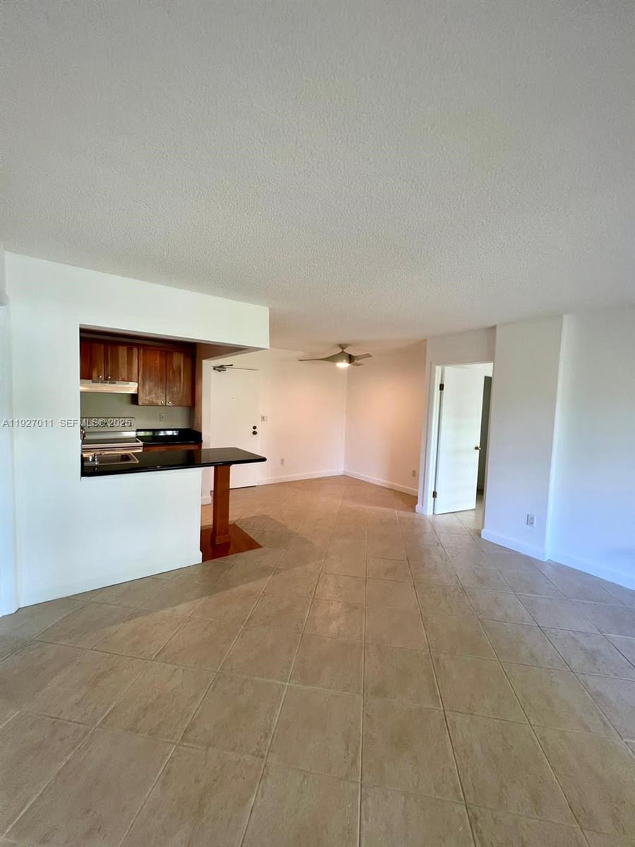 2201 Brickell Avenue, Unit 83 Miami, FL 33129 - Photo 15 of 16 a view of empty room with kitchen and window