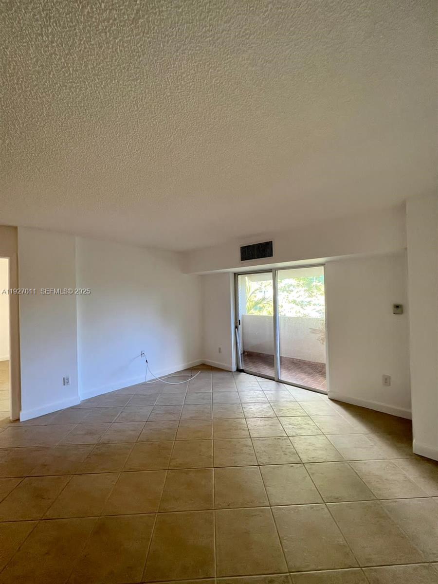 2201 Brickell Avenue, Unit 83 Miami, FL 33129 - Photo 4 of 16 an empty room with windows