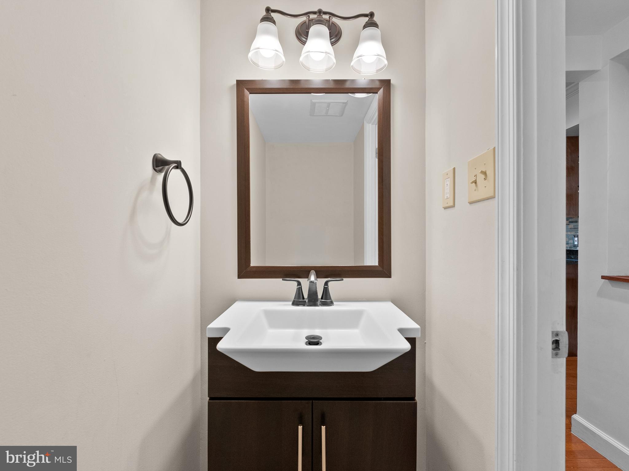 2459 Pyrenees Court Reston, VA 20191 - Photo 12 of 28 a bathroom with a sink and a mirror