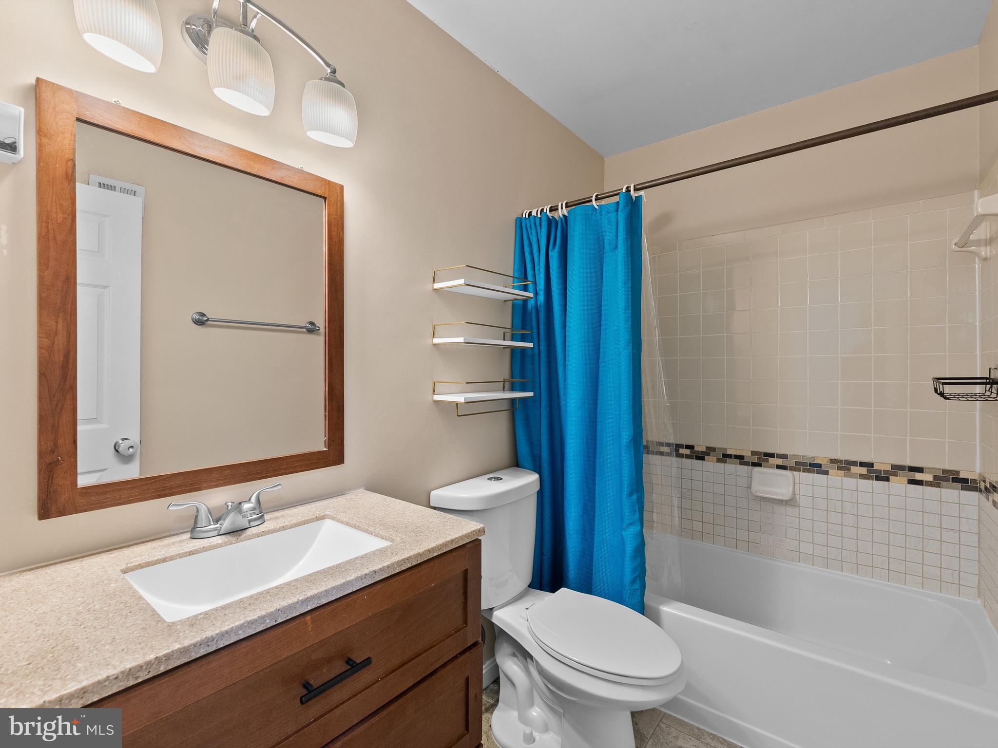2459 Pyrenees Court Reston, VA 20191 - Photo 13 of 28 a bathroom with a sink a toilet and shower