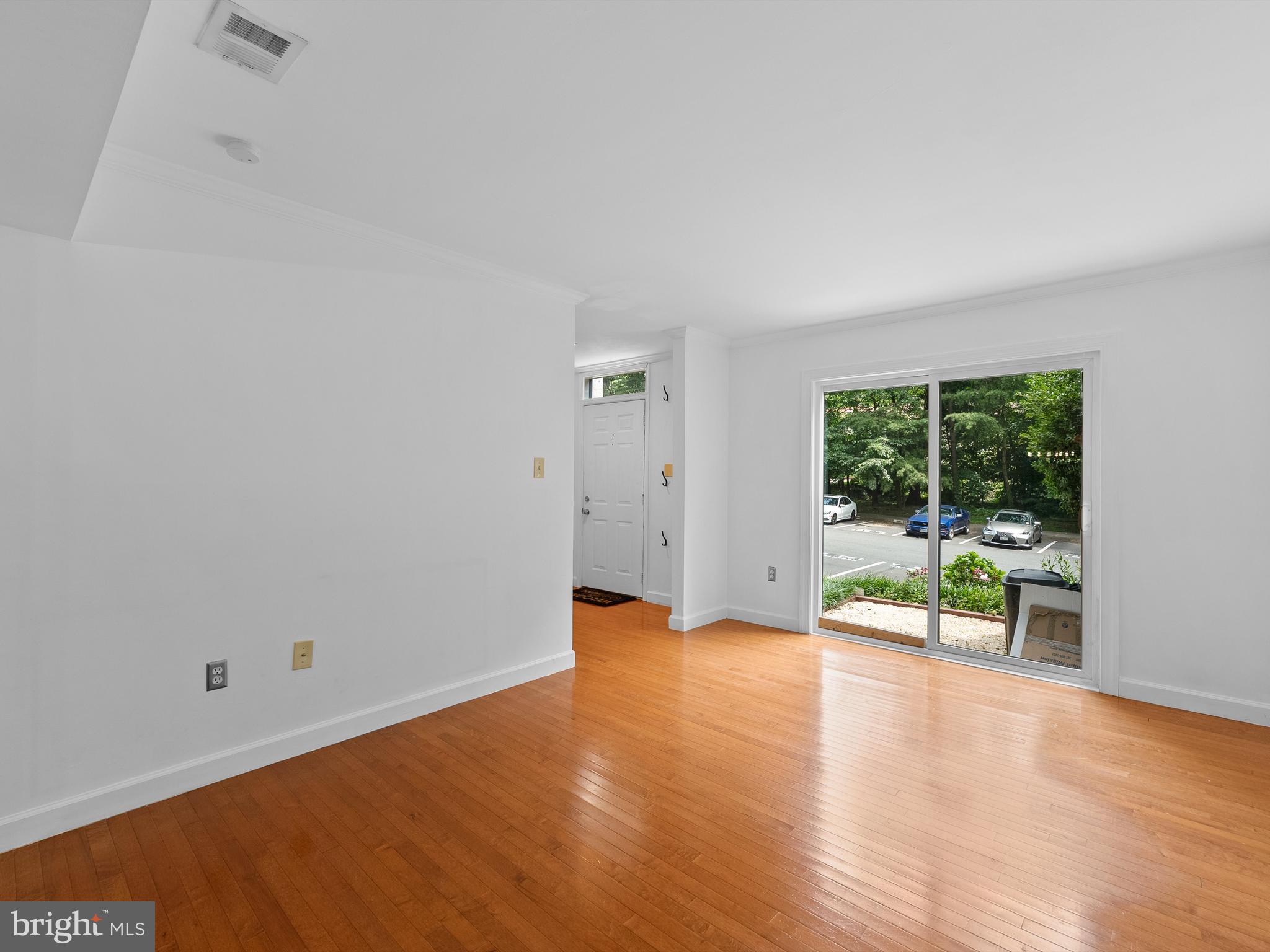 2459 Pyrenees Court Reston, VA 20191 - Photo 6 of 28 wooden floor in an empty room with a window