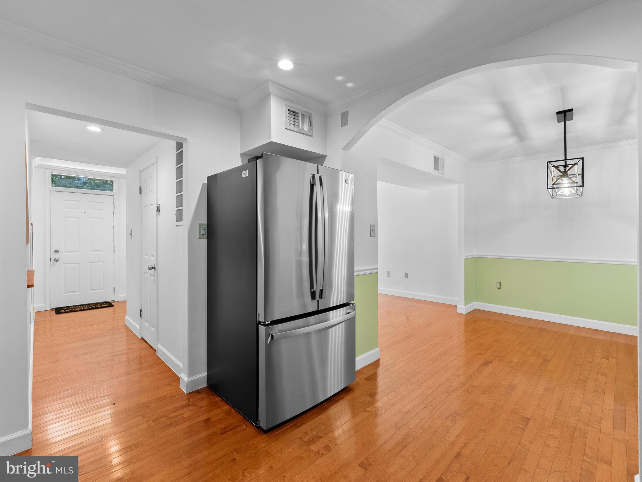 2459 Pyrenees Court Reston, VA 20191 - Photo 10 of 28 a view of a kitchen with wooden floor and a refrigerator