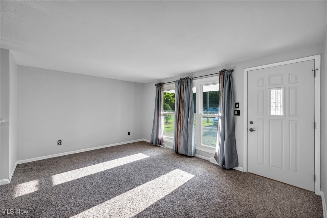 1135 Keefer Road Girard, OH 44420 - Photo 12 of 32 Carpeted foyer featuring baseboards