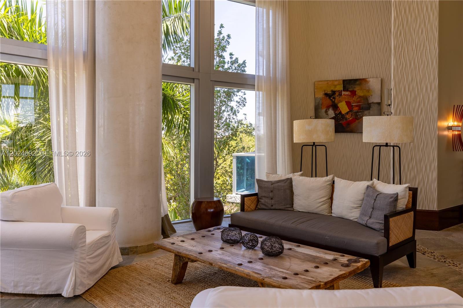 2641 North Flamingo Road, Unit 2605N Sunrise, FL 33323 - Photo 26 of 56 a living room with furniture and a large window
