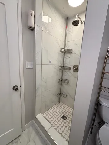 a bathroom with a sink and a shower